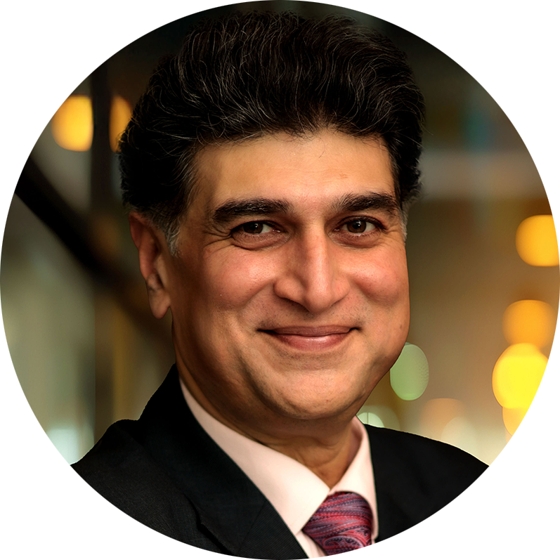 Founder Mo Azeem smiling in a professional portrait for MinorCare.