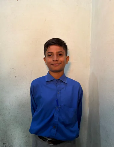Ashir Farman, a Christian Grade 4 student supported by MinorCare, photographed in his classroom in Pakistan.
