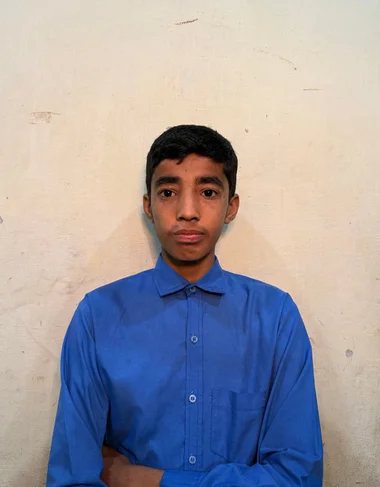 Nouman Allah Rakha, a Christian Grade 3 student supported by MinorCare, smiling in his classroom in Pakistan.