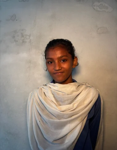 Shehzadi Ramzan, a Christian Grade 2 student supported by MinorCare, smiling in her classroom in Pakistan.