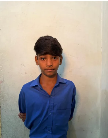 Tanveer Rehmat, a Christian Grade 4 student supported by MinorCare, photographed in his classroom in Pakistan.