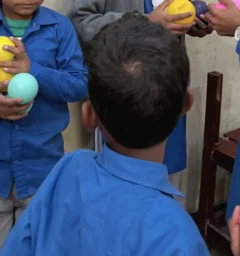 Christian children at MinorCare smiling and learning together in a supportive classroom environment in Pakistan.