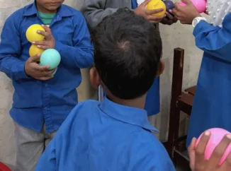 Christian children at MinorCare smiling and learning together in a supportive classroom environment in Pakistan.