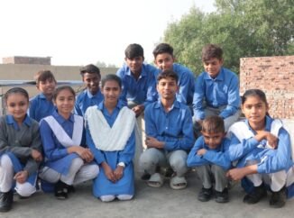 Group of children in school uniforms.