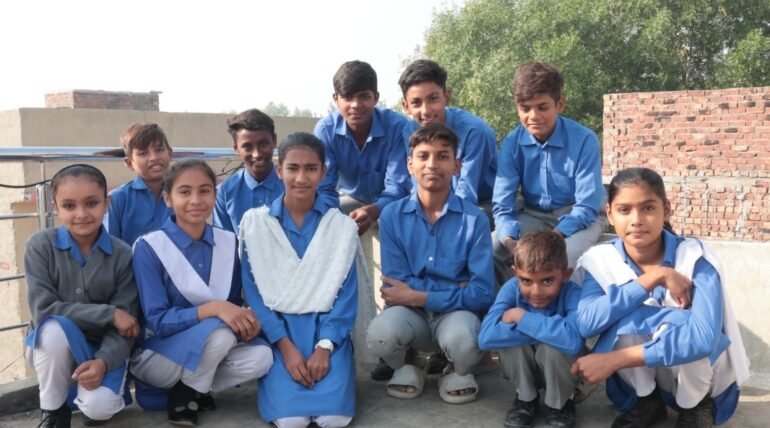 Group of children in school uniforms.